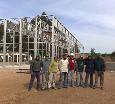 Brazilian customer in front of lumber drying kiln